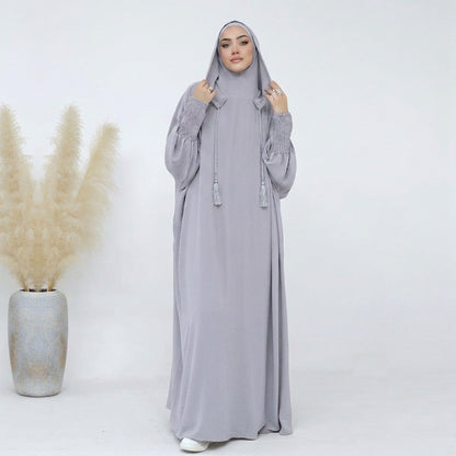 Light gray hooded prayer abaya, full-length front view, cotton-blend with tassel drawstrings